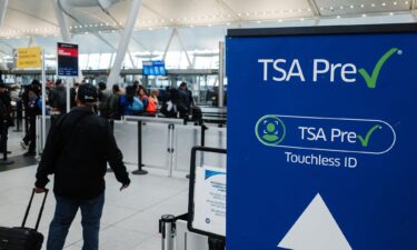 Passengers use Clear security screening machines at Hartsfield-Jackson Atlanta International Airport in Atlanta in 2022. The service is run by a for-profit company and while it offers some of the same advantages as TSA PreCheck
