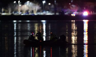 Emergency response units conduct search and rescue operations in the Potomac River near Ronald Reagan Washington Airport on January 30.