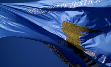 A flag flutters outside the Department of Justice building in Washington