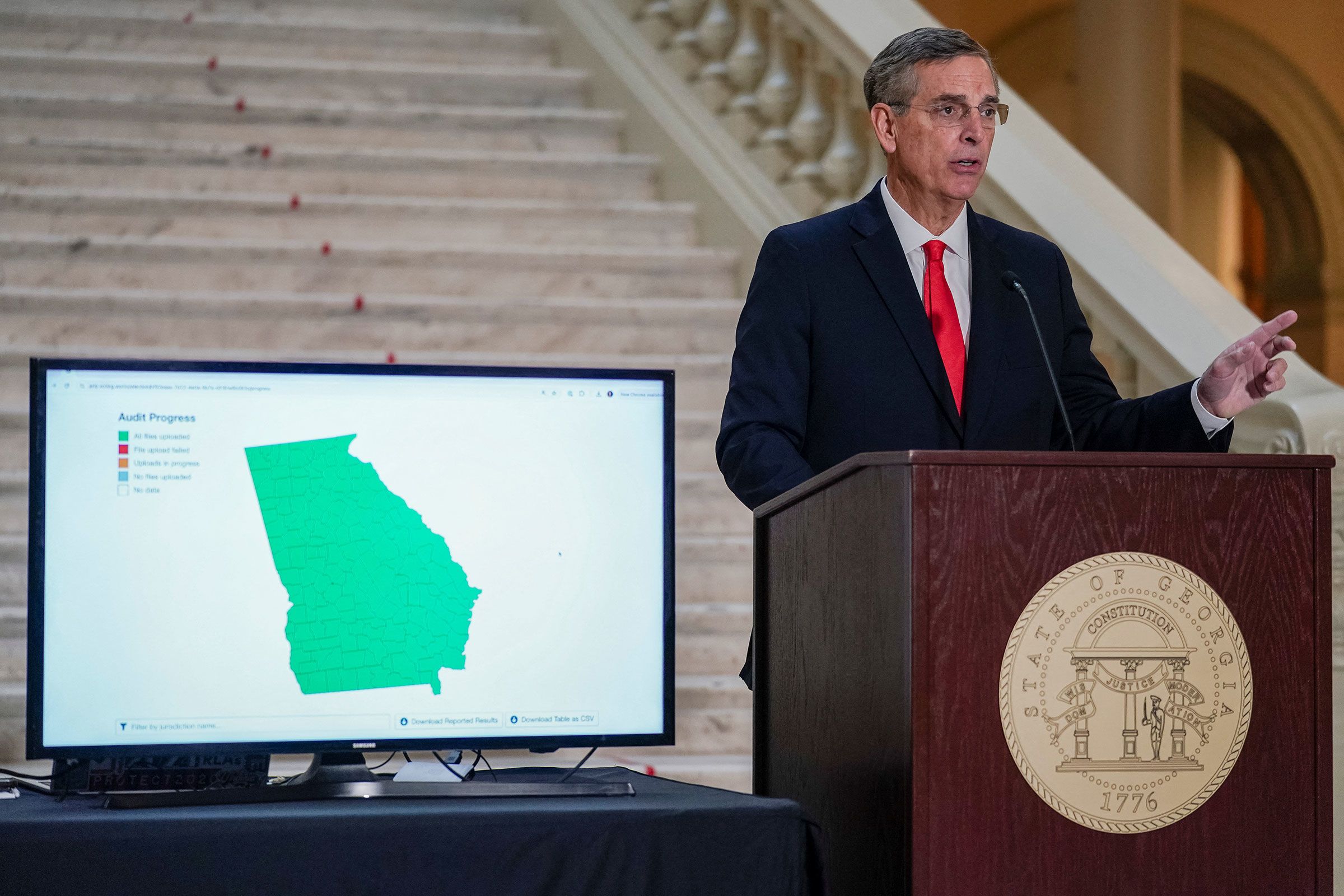 <i>Al Drago/Pool/Reuters/File via CNN Newsource</i><br/>A transcript of a phone call between Donald Trump and Brad Raffensperger appears on a screen during a hearing of the Select Committee to Investigate the January 6th Attack on the US Capitol