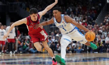 Duke guard Caleb Foster drives past St. John's guard Dylan Darling in the second half of their Sweet Sixteen game on March 27.