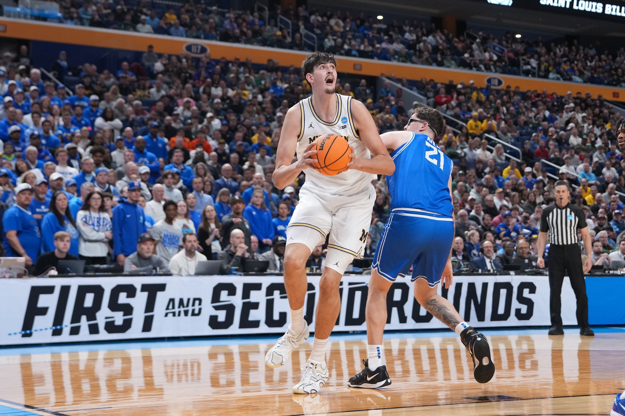 <i>Mark Konezny/Imagn Images via CNN Newsource</i><br/>Saint Louis Billikens guard Amari McCottry shoots while defended by Michigan Wolverines center Aday Mara in the first half Saturday.