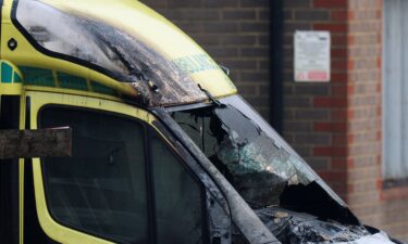 A man records using his mobile phone near the scene of the attack that  police say is being treated as an antisemitic hate crime.