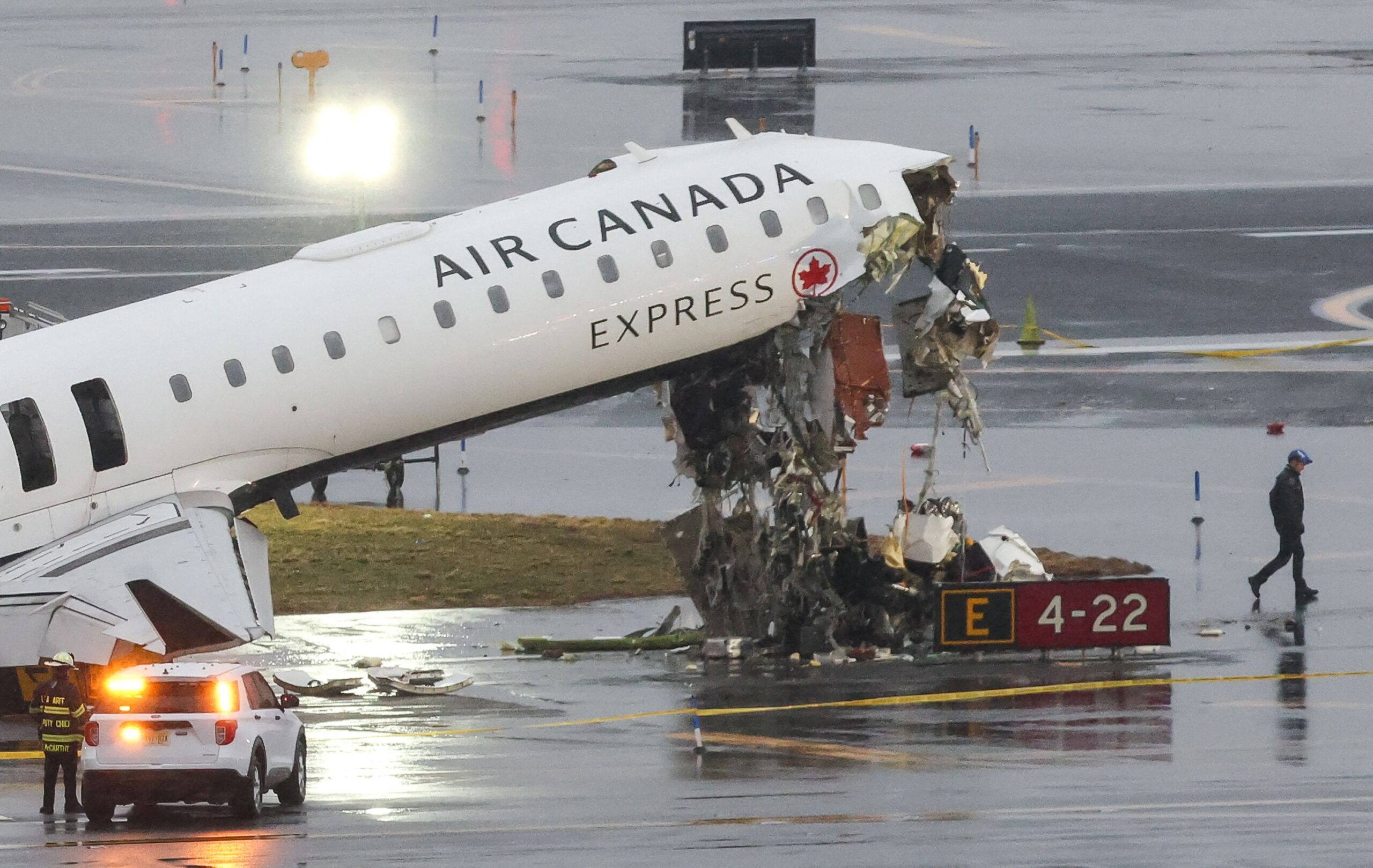 <i>Timothy A. Clary/AFP/Getty Images via CNN Newsource</i><br/>An Air Canada Express CRJ-900 sits on the runway after colliding with a Port Authority fire truck (L) at LaGuardia Airport in New York.
