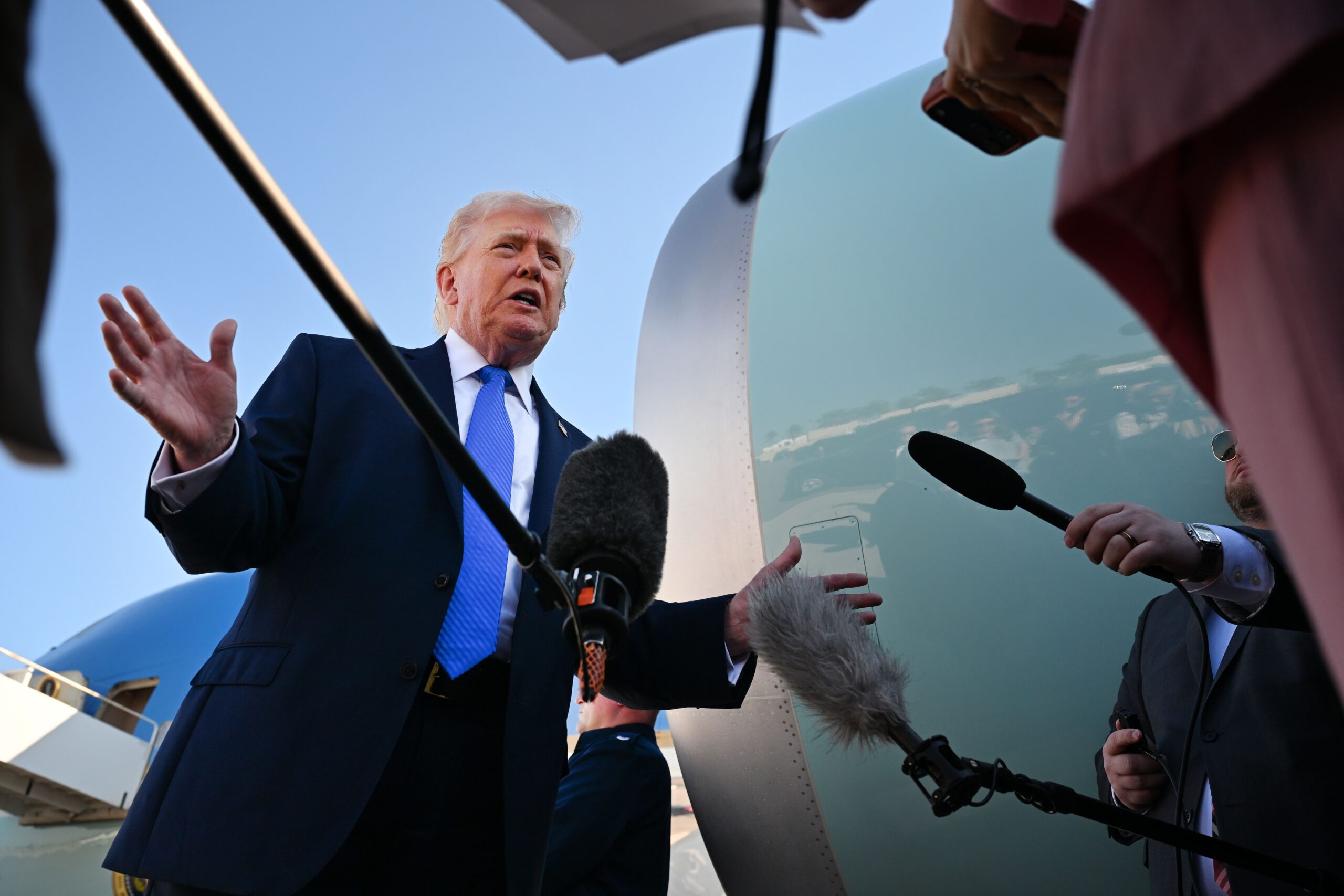 <i>Roberto Schmidt/Getty Images via CNN Newsource</i><br/>President Donald Trump speaks to reporters before boarding Air Force One at Palm Beach International Airport on Monday in West Palm Beach