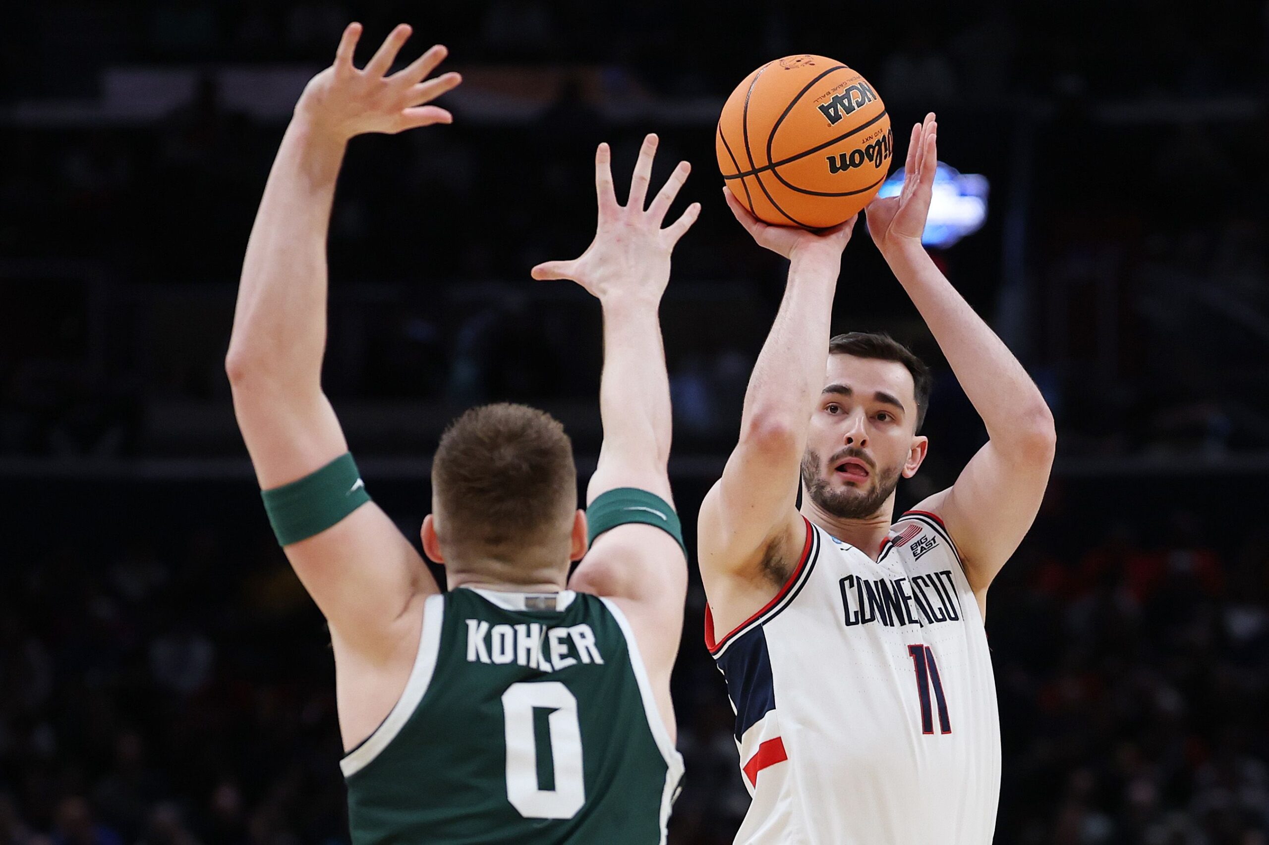<i>Stephanie Scarbrough/AP via CNN Newsource</i><br/>UConn forward Tarris Reed Jr. dunks as Michigan State forward Cameron Ward defends during the first half in their Sweet 16 game on Friday.