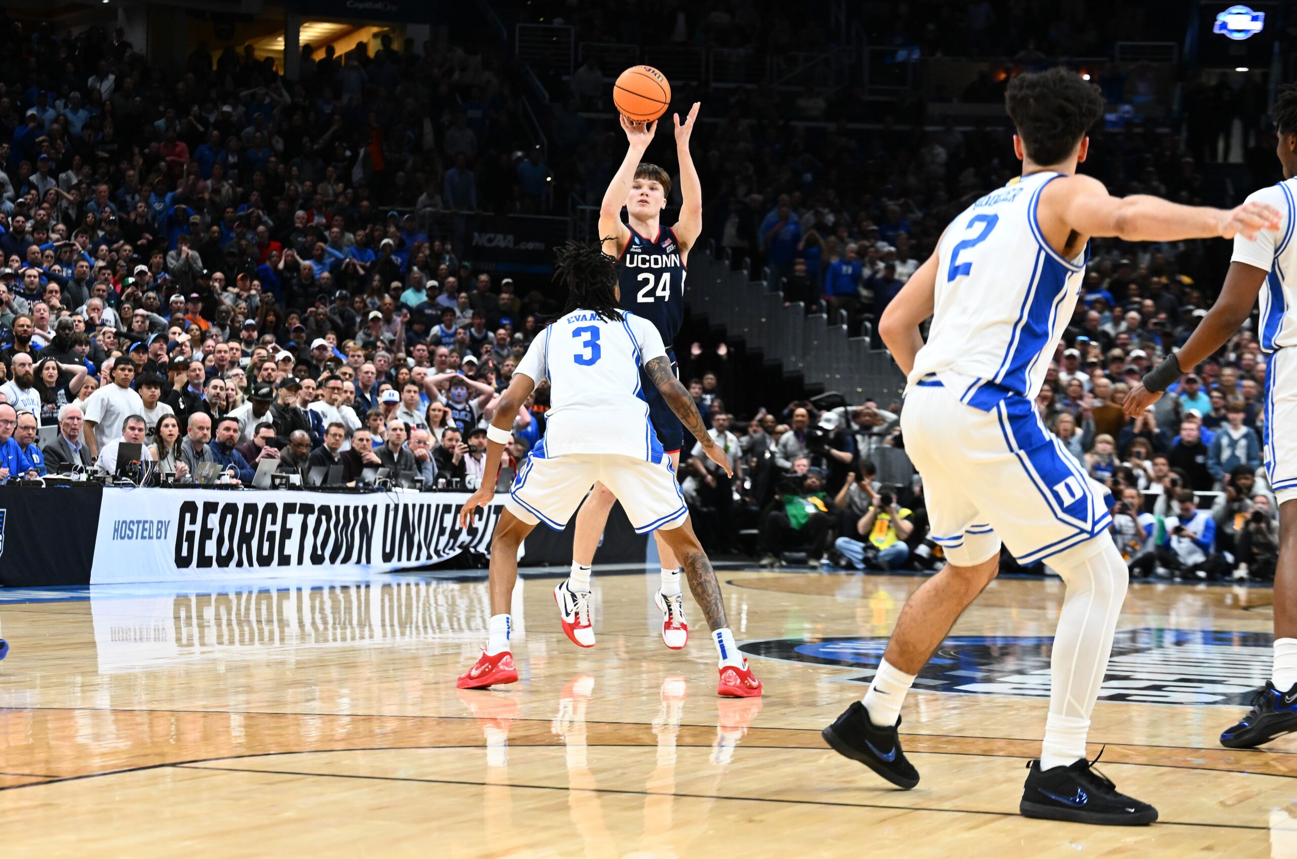 <i>Emilee Chinn/Getty Images via CNN Newsource</i><br/>Mullins and Malachi Smith #0 of the UConn Huskies celebrate during the second half of a game in the Elite Eight of the 2026 NCAA Men's Basketball Tournament at Capital One Arena in Washington