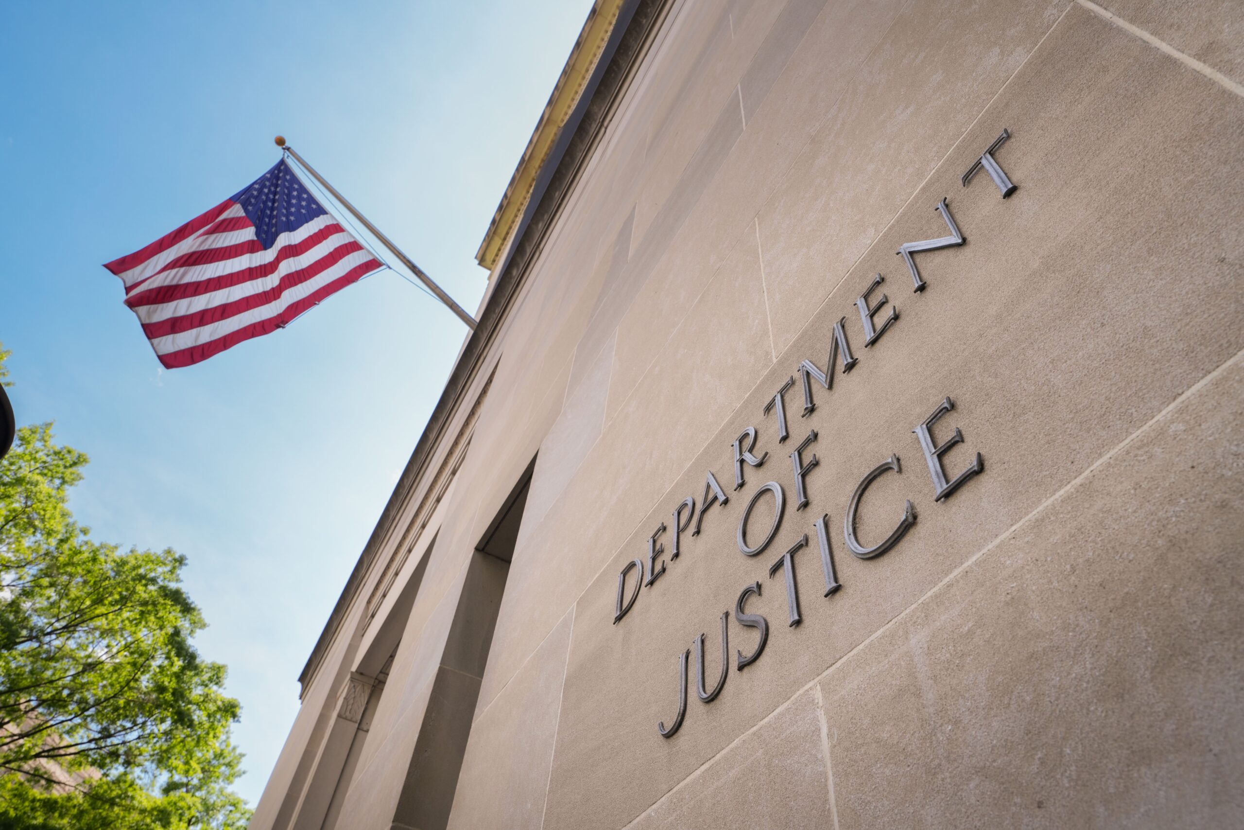 <i>J. David Ake/Getty Images via CNN Newsource</i><br/>A sign marks the location of the U.S. Department of Justice (DOJ) headquarters building on April 30