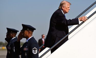 U.S. President Donald Trump boards Air Force One at Palm Beach International Airport on March 23 in West Palm Beach