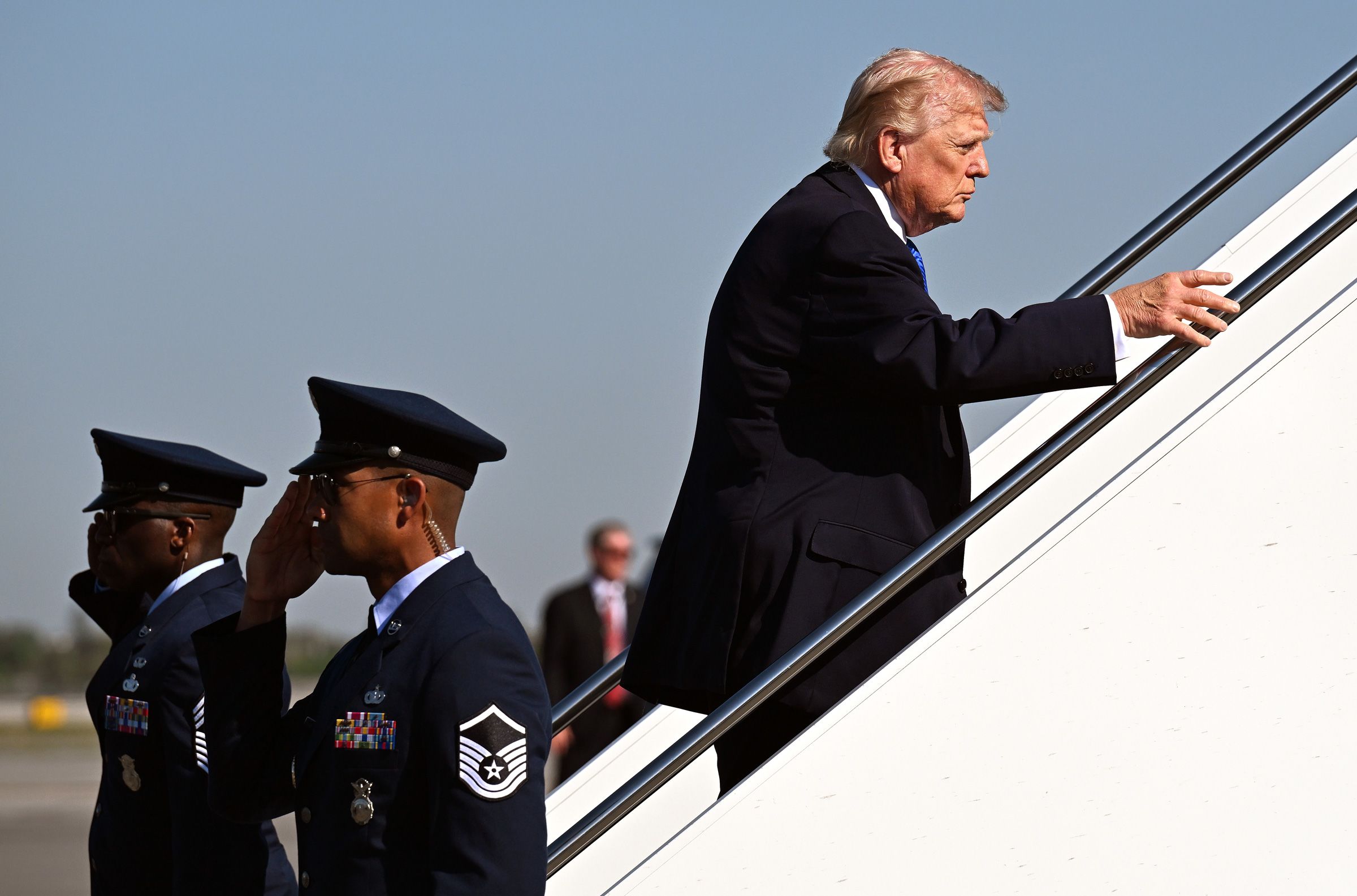<i>Roberto Schmidt/Getty Images via CNN Newsource</i><br/>U.S. President Donald Trump boards Air Force One at Palm Beach International Airport on March 23 in West Palm Beach