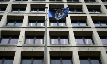 An FBI flag flutters outside the the J. Edgar Hoover Building in Washington