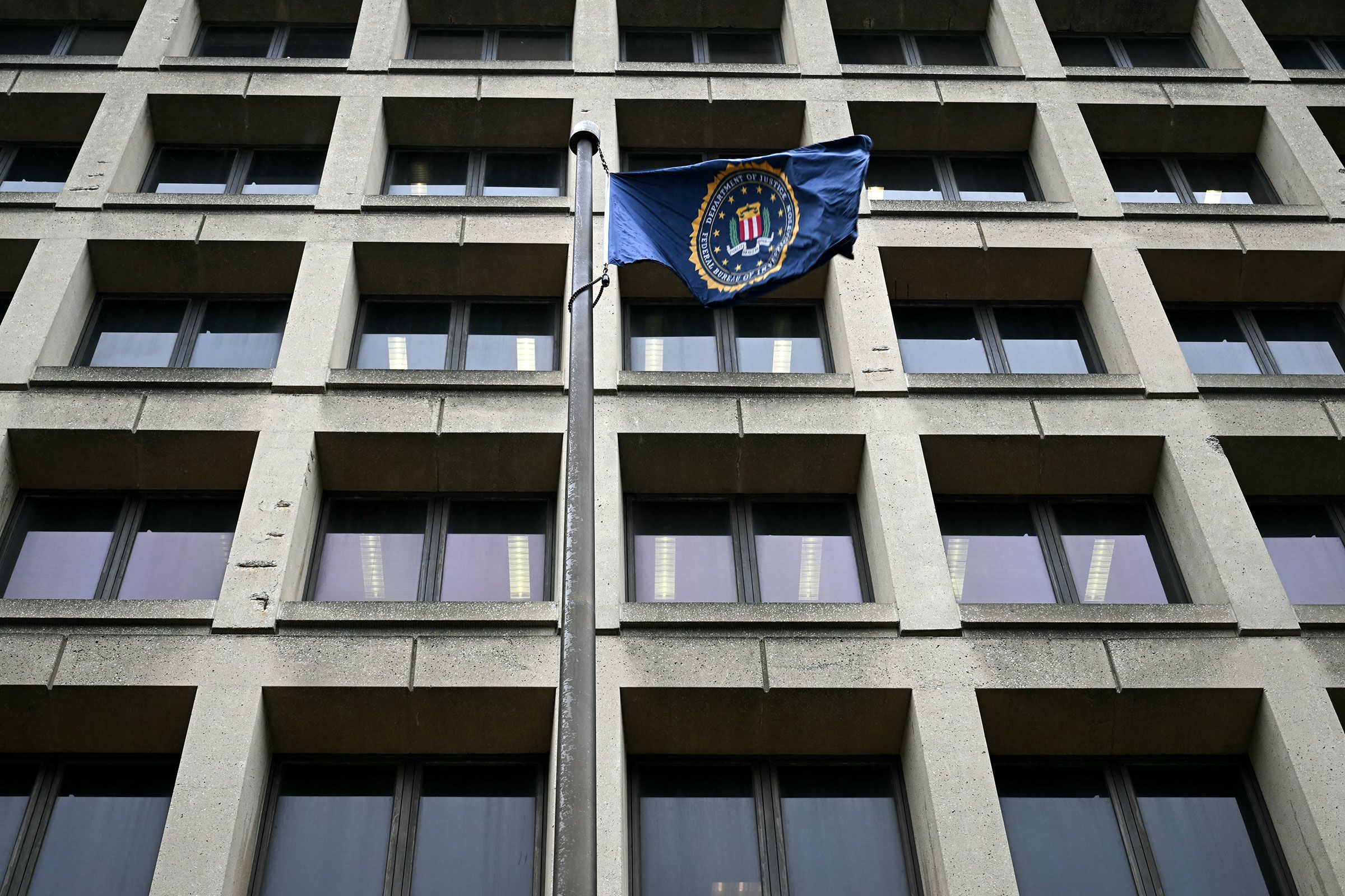 <i>Brendan Smialowski/AFP/Getty Images/File via CNN Newsource</i><br/>An FBI flag flutters outside the the J. Edgar Hoover Building in Washington