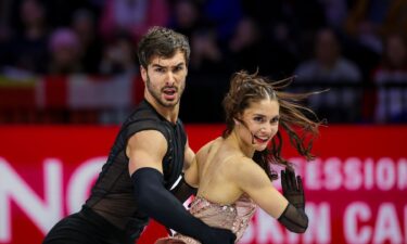 Laurence Fournier Beaudry and Guillaume Cizeron perform during their rhythm dance routine at the 2026 World Figure Skating Championships.