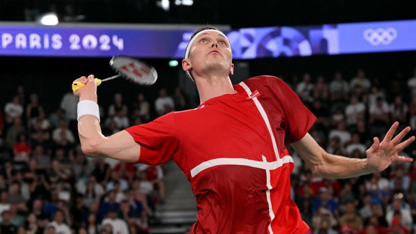 Denmark's Viktor Axelsen plays a shot against Thailand's Kunlavut Vitidsarn in the men's singles badminton final match during the Paris 2024 Olympic Games at Porte de la Chapelle Arena in Paris on August 5