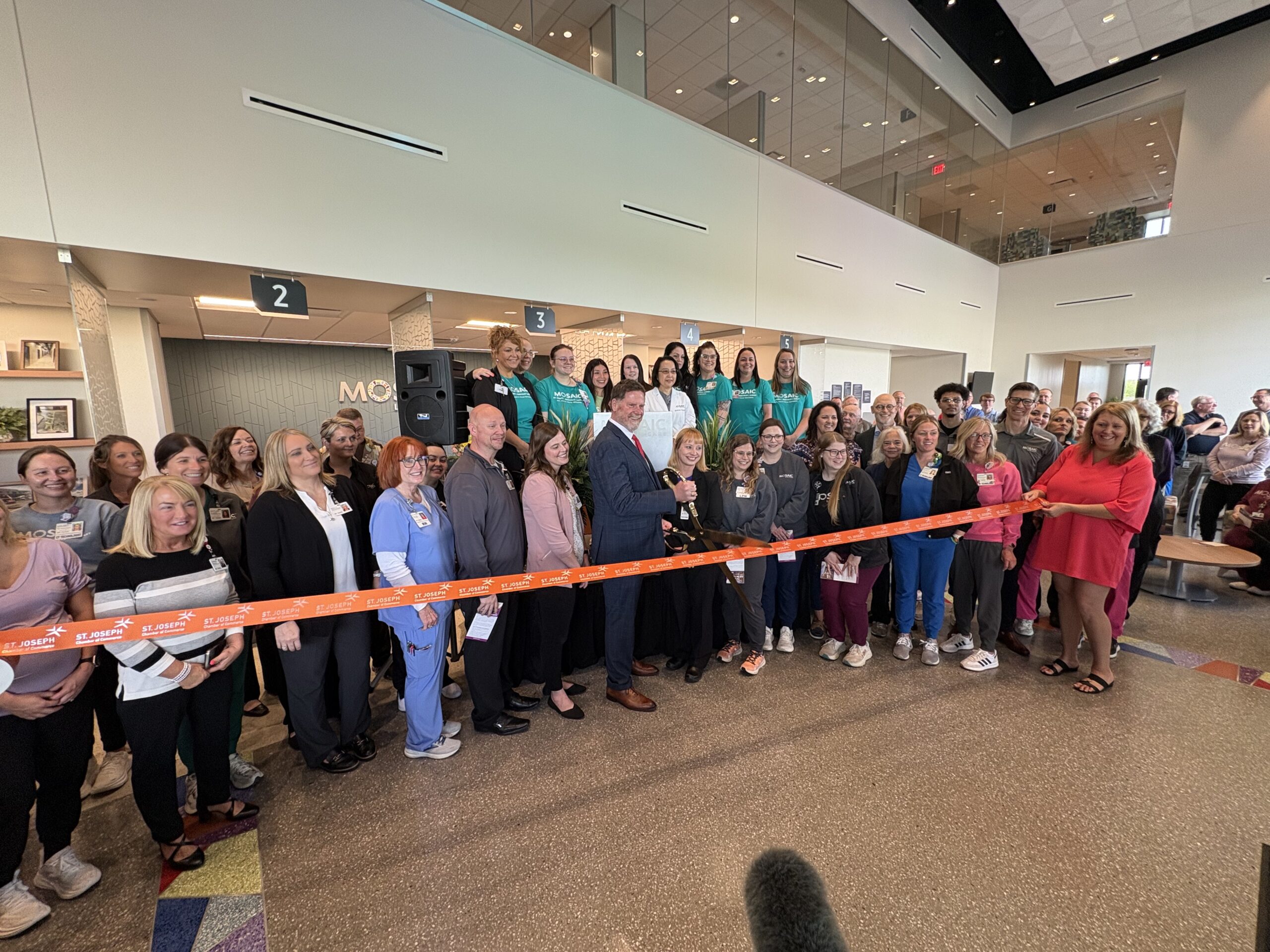 Mosaic Life Care CEO cutting the ribbon at Plaza 4.