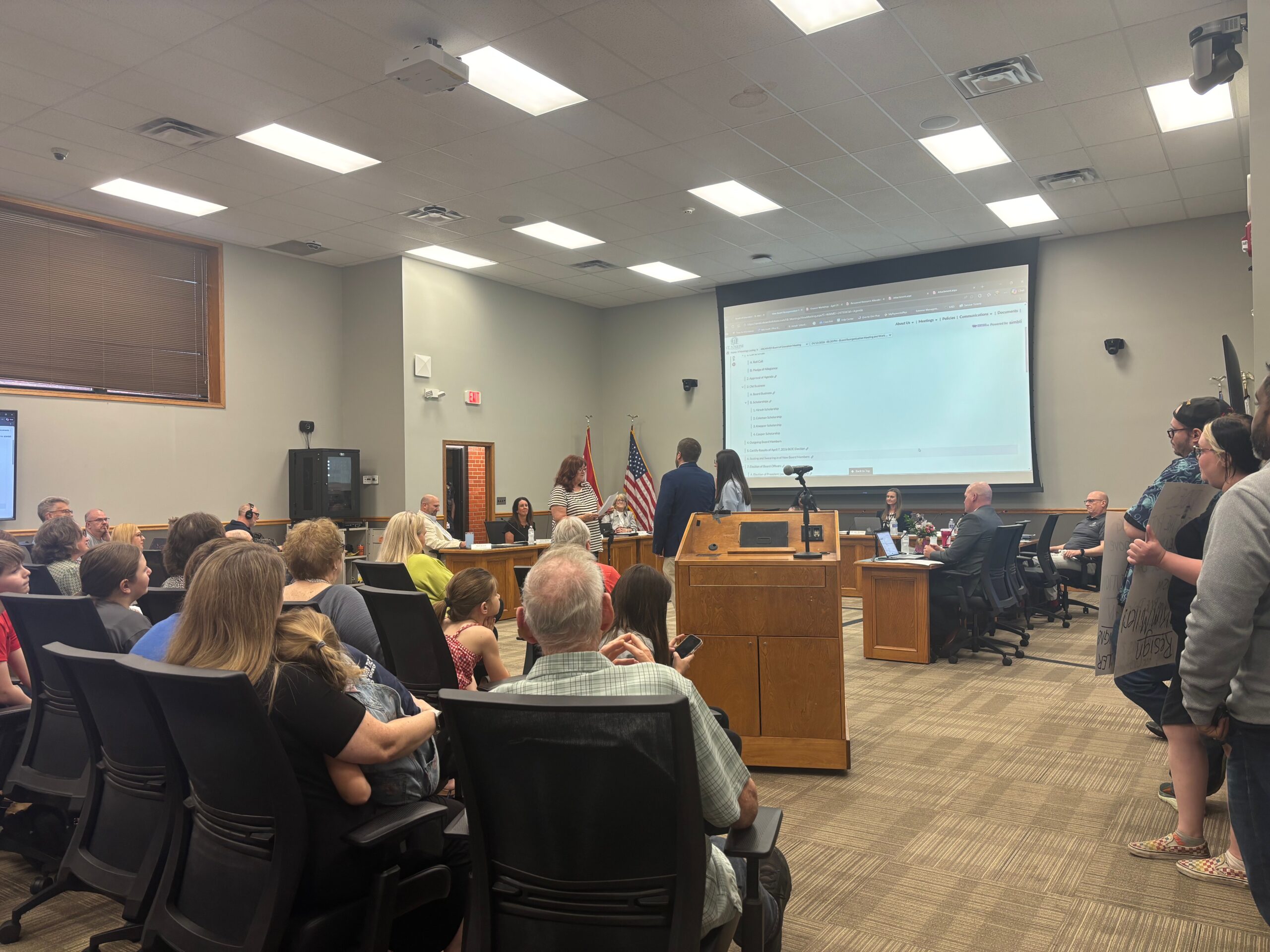 Cassandra Veale and Jacob McMillian being sworn in at the St. Joseph School board meeting.