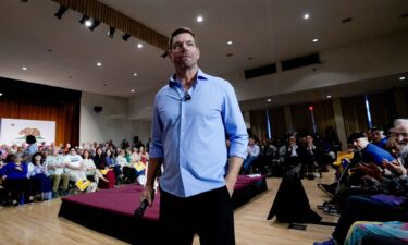 California gubernatorial candidate Rep. Eric Swalwell listens to a question from the audience during a town hall meeting in Sacramento on Tuesday
