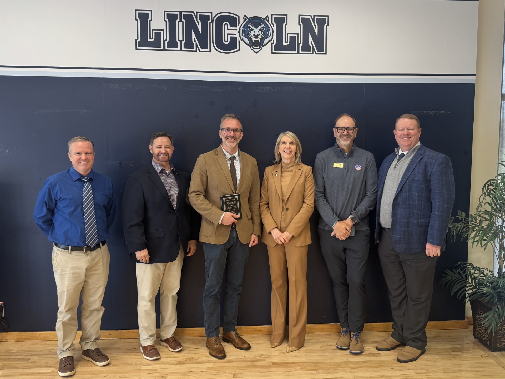 Dr. DesAutels is congratulated by Dr. Kennedy and other MoWest officials at the COPHE luncheon.