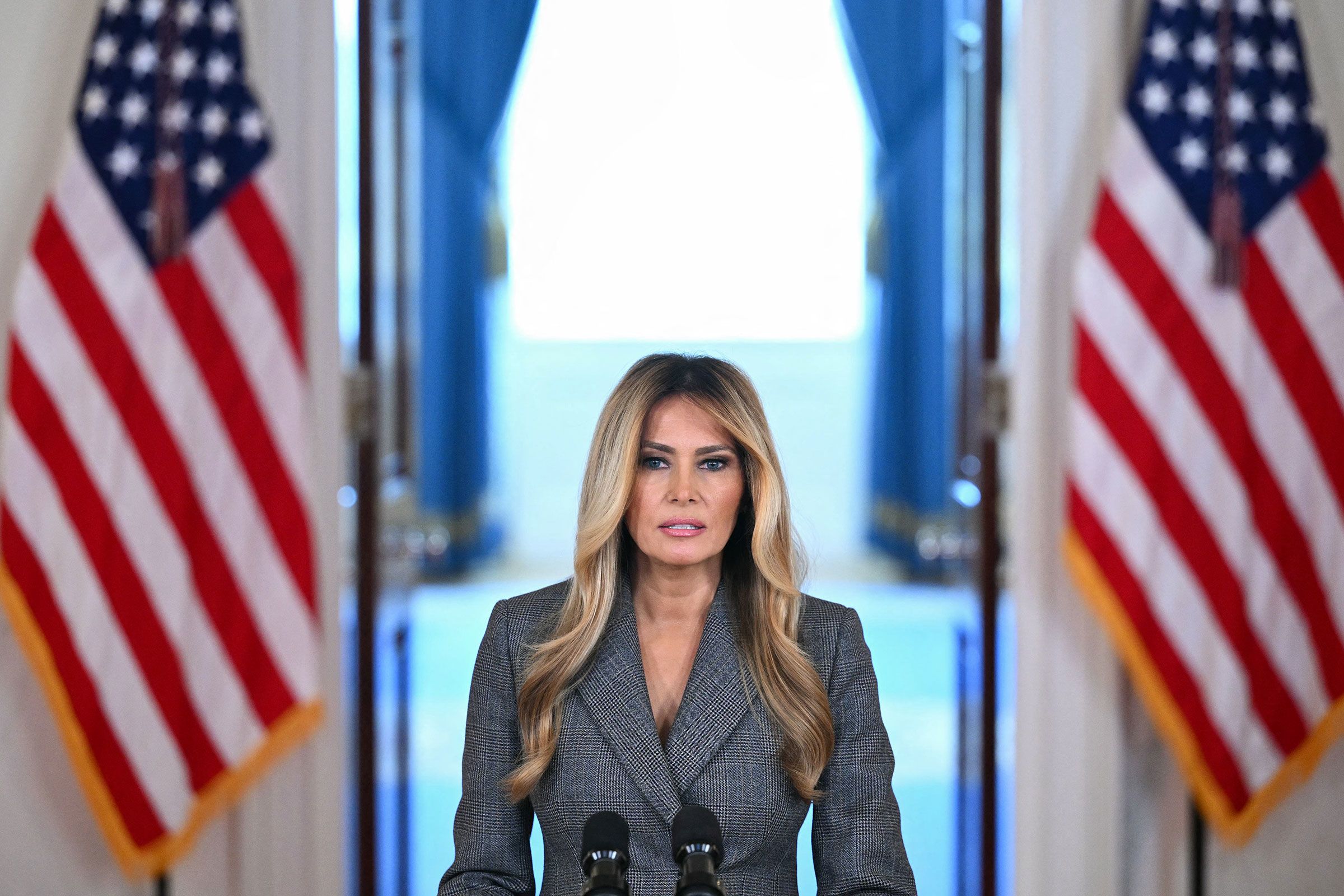 <i>Mandel Ngan/AFP/Getty Images via CNN Newsource</i><br/>First lady Melania Trump speaks in the Cross Hall of the White House on April 9.