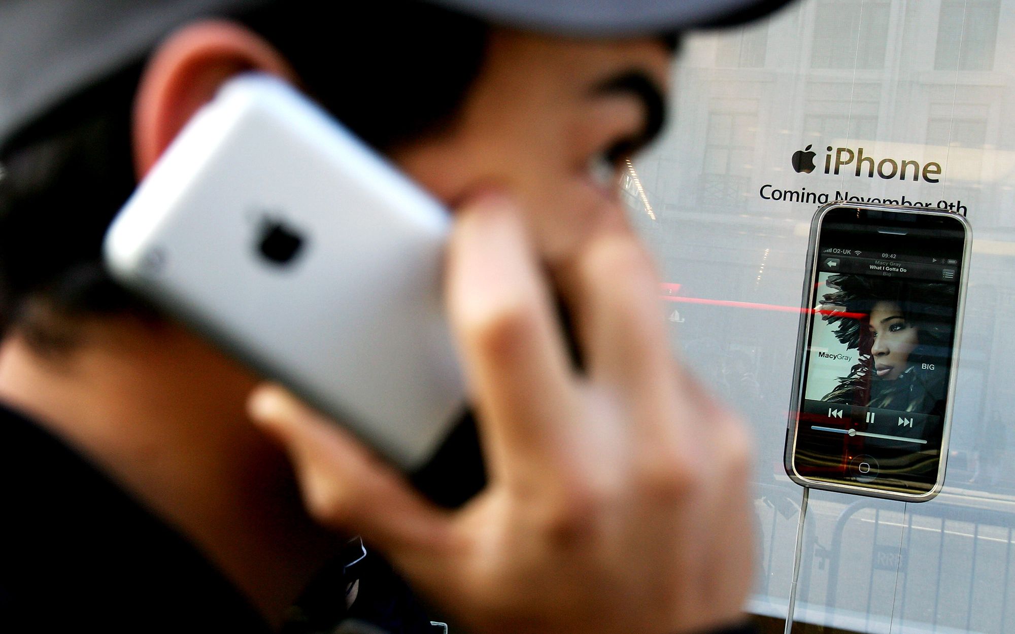 <i>Gareth Cattermole/Getty Images via CNN Newsource</i><br/>A man uses an Apple iPhone outside the Apple store on Regent Street on device's UK launch day
