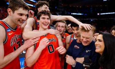 Illinois head coach Brad Underwood celebrates with his team after the Illini's Sweet 16 win against Houston last week.