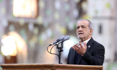 Iranian President Masoud Pezeshkian speaks during a visit to a shrine in Tehran on January 31