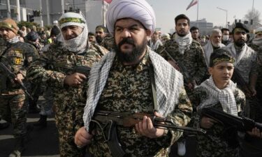 Members of the Iran's Basij paramilitary force march during a military parade held in the capital Tehran on January 10