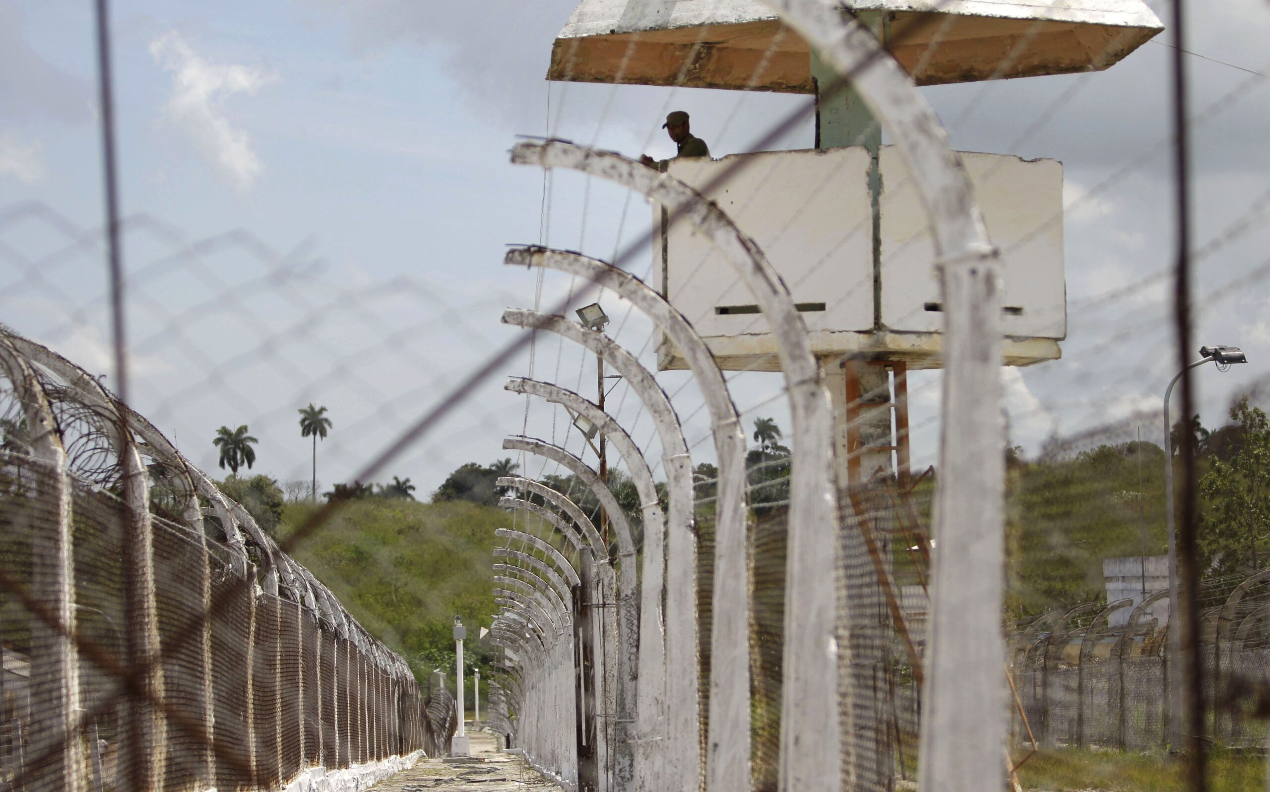 <i>Franklin Reyes/AP via CNN Newsource</i><br/>A military guard observes from a watch tower at the Combinado del Este prison during a media tour in Havana