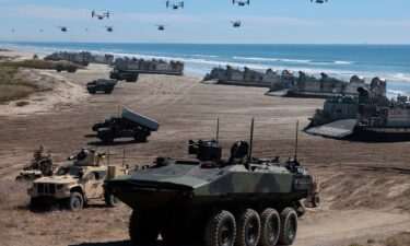 Navy Landing Craft Air Cushion's unload equipment onto the beach as US Marine Corps V-22 Ospreys and CH-53 Super Stallions fly overhead during the America's Marines 250 event at Camp Pendleton's Red Beach in Oceanside