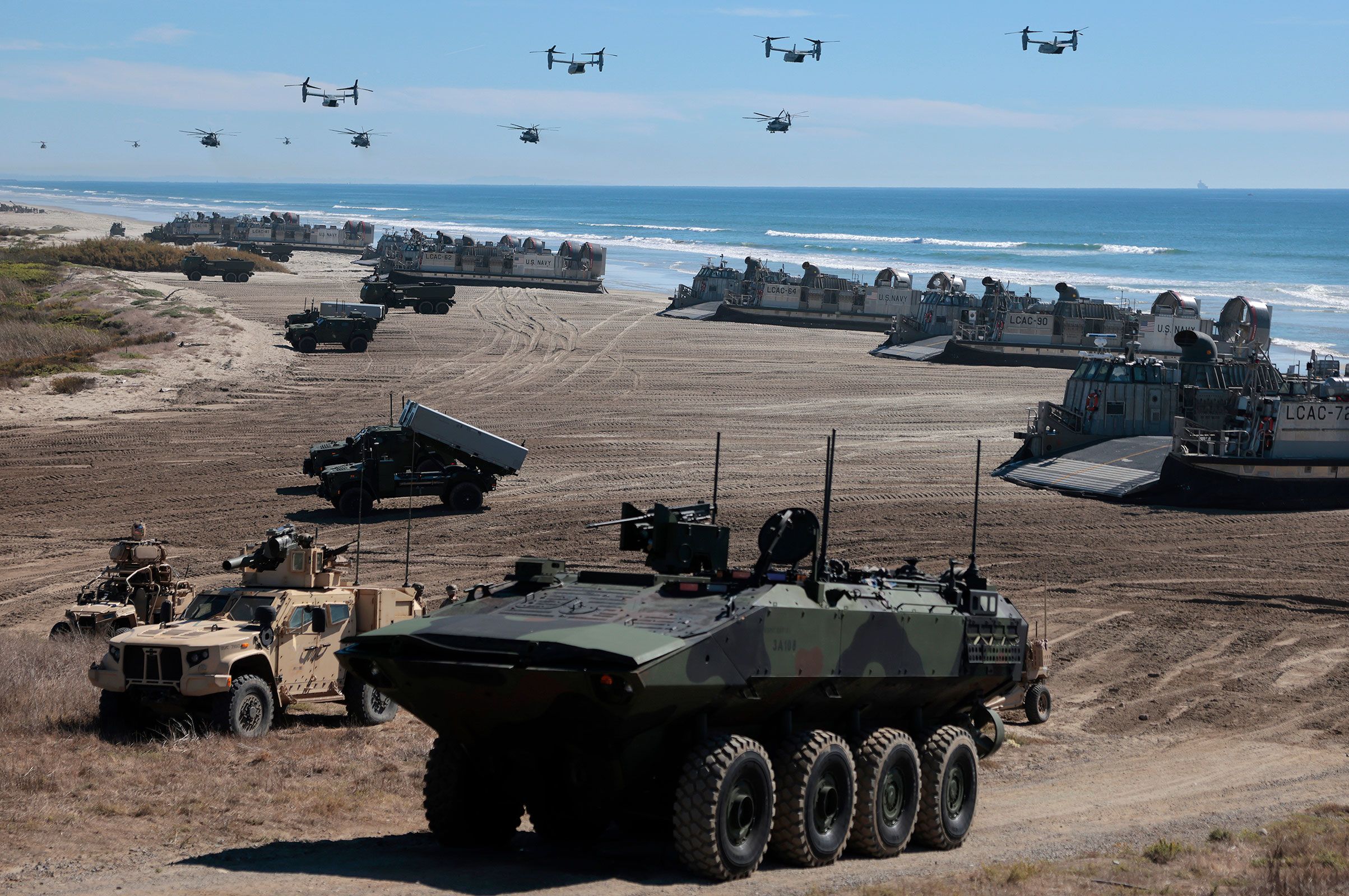 <i>Mario Tama/Getty Images/File via CNN Newsource</i><br/>Navy Landing Craft Air Cushion's unload equipment onto the beach as US Marine Corps V-22 Ospreys and CH-53 Super Stallions fly overhead during the America's Marines 250 event at Camp Pendleton's Red Beach in Oceanside