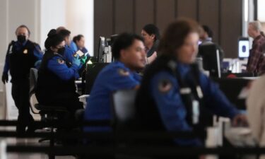 Covenant Aviation Security Private Security Services agents check in passengers at a security gate at San Francisco International Airport.