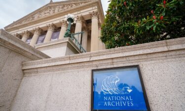 A sign marks the location of the Archives of the United States building in Washington
