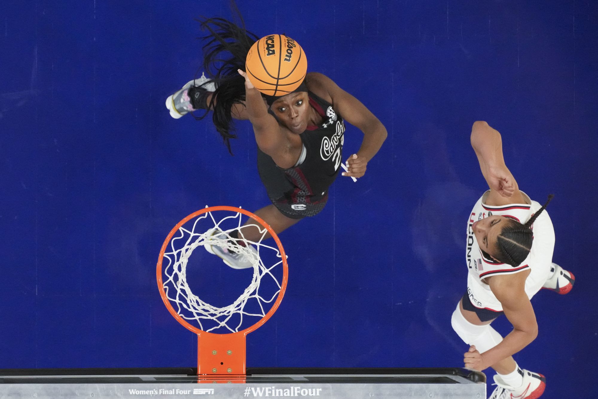 <i>Kirby Lee/Imagn Images/Reuters Connect via CNN Newsource</i><br/>UConn Huskies forward Sarah Strong fights for the ball against South Carolina Gamecocks guard Ta'niya Latson and center Madina Okot in the second half.