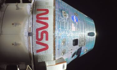 A camera on Orion's solar array wings shows the moon in the distance on the mission's second day.