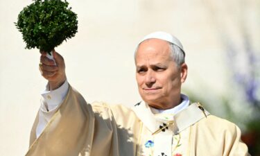 People attend the Easter Mass led by Pope Leo XIV in St. Peter's Square at the Vatican