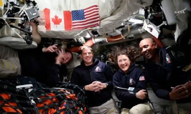 The Artemis II crew takes interviews from the Orion capsule in outer space. From left