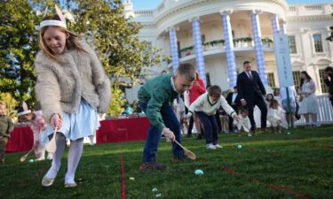 President Donald Trump greets the crowd during the annual Easter Egg Roll on Monday.