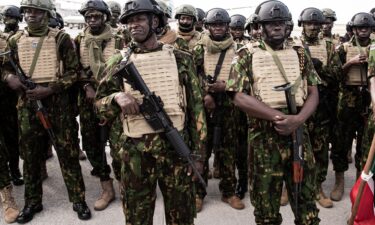Kenyan police officers arrive at Toussaint Louverture International Airport in Port-au-Prince
