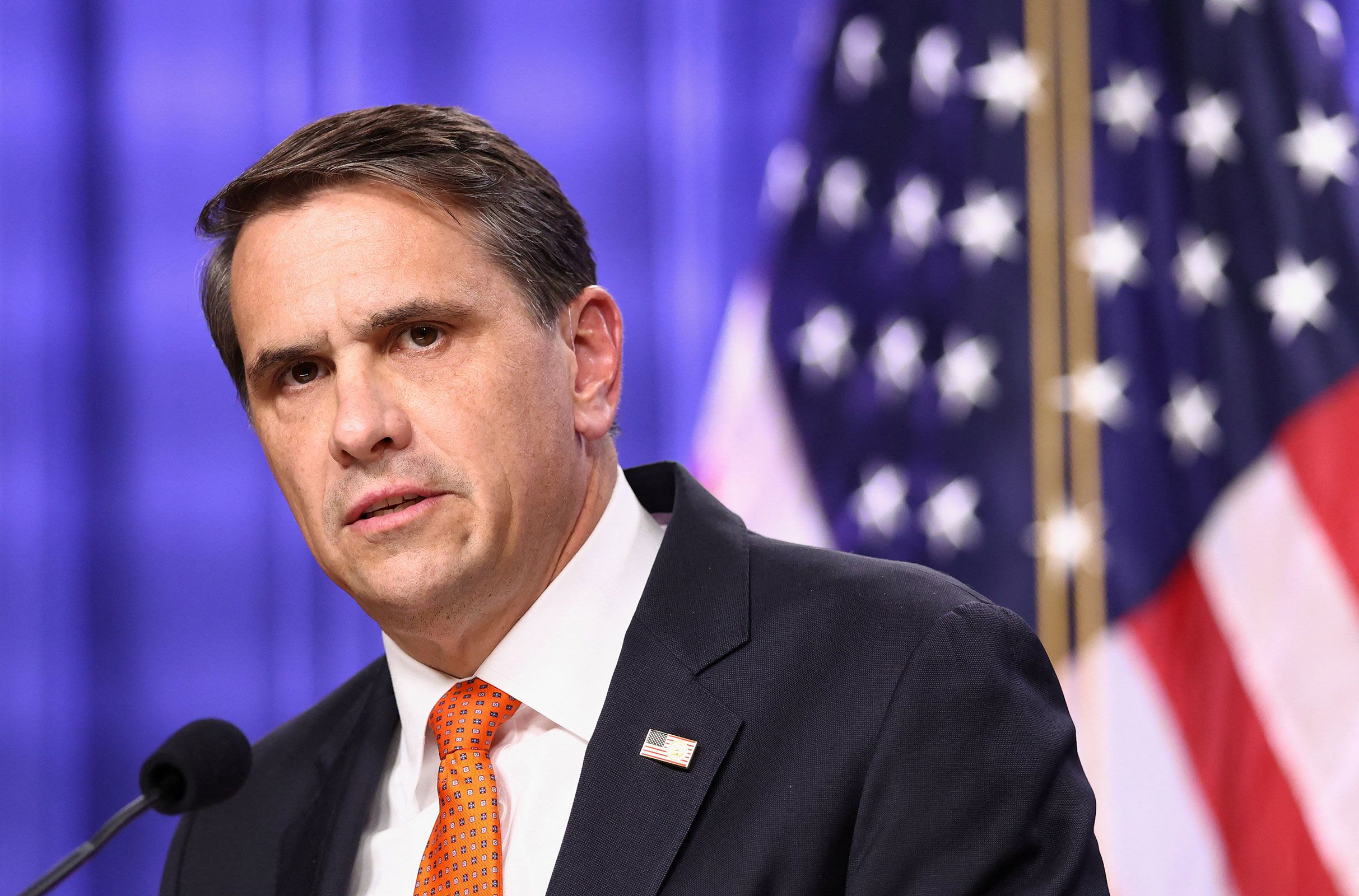 <i>Chip Somodevilla/Getty Images via CNN Newsource</i><br/>Portraits of President Donald Trump and former US Attorney General Pam Bondi are seen during a news conference with acting US Attorney General Todd Blanche