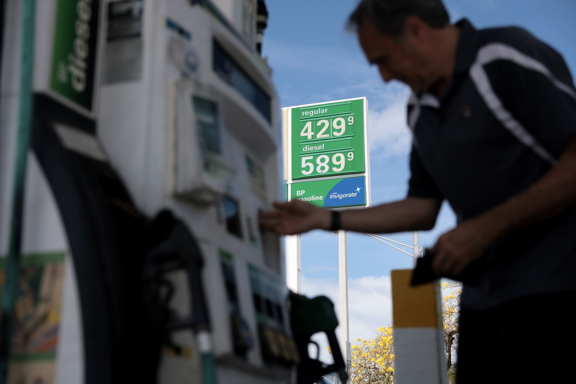 <i>Joe Raedle/Getty Images via CNN Newsource</i><br/>Carlos Ferre fuels up at a gas station on April 6 in Miami