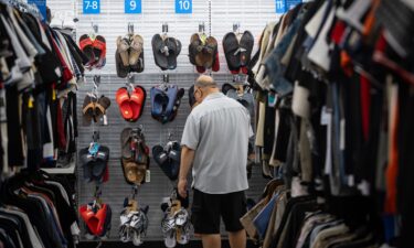 A man shops for sandals at a Ross store on March 17 in Alhambra