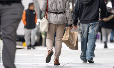 Shoppers carry bags in the Union Square neighborhood of San Francisco on January 21. Consumer sentiment plummeted to its lowest level on record due to frustration with price spikes from the US-Israeli war with Iran.