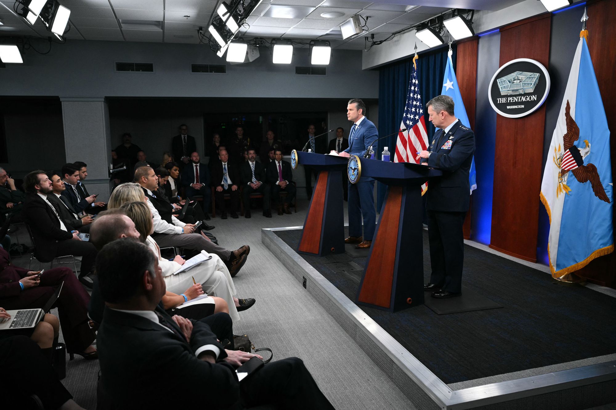 <i>Mandel Ngan/AFP/Getty Images via CNN Newsource</i><br/>US Secretary of Defense Pete Hegseth speaks alongside Chairman of the Joint Chiefs of Staff General Dan Caine during a press briefing at the Pentagon in Washington