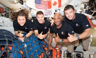 Artemis II crew members Christina Koch (left) and Victor Glover (middle right) can be seen wearing wrist devices that measure their sleep and wellbeing.