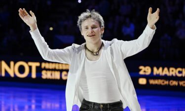 Ilia Malinin poses on the ice during a figure skating event.