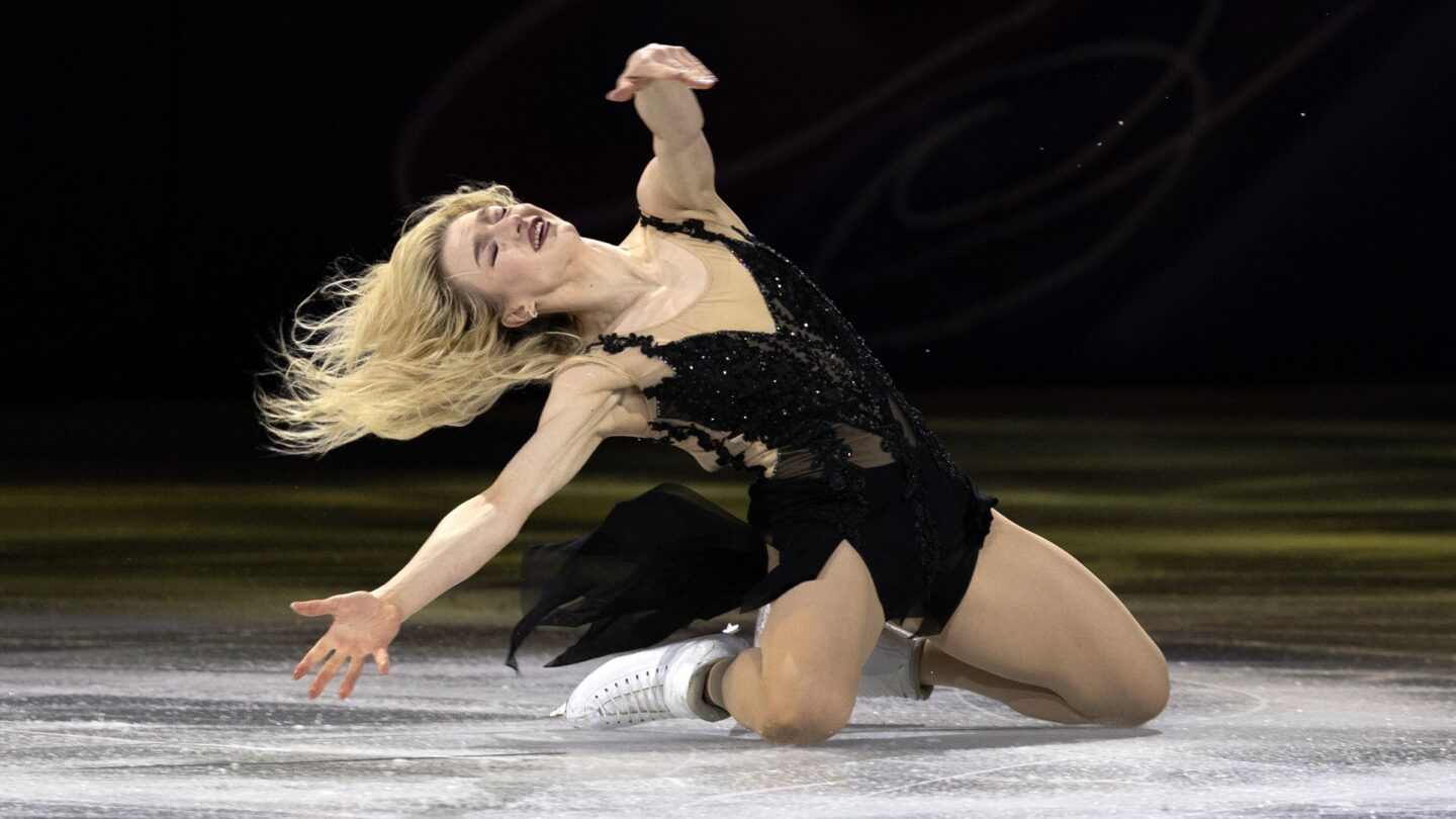 <i>NBC Olympics</i><br/>Amber Glenn strikes a pose during one of her figure skating routines.