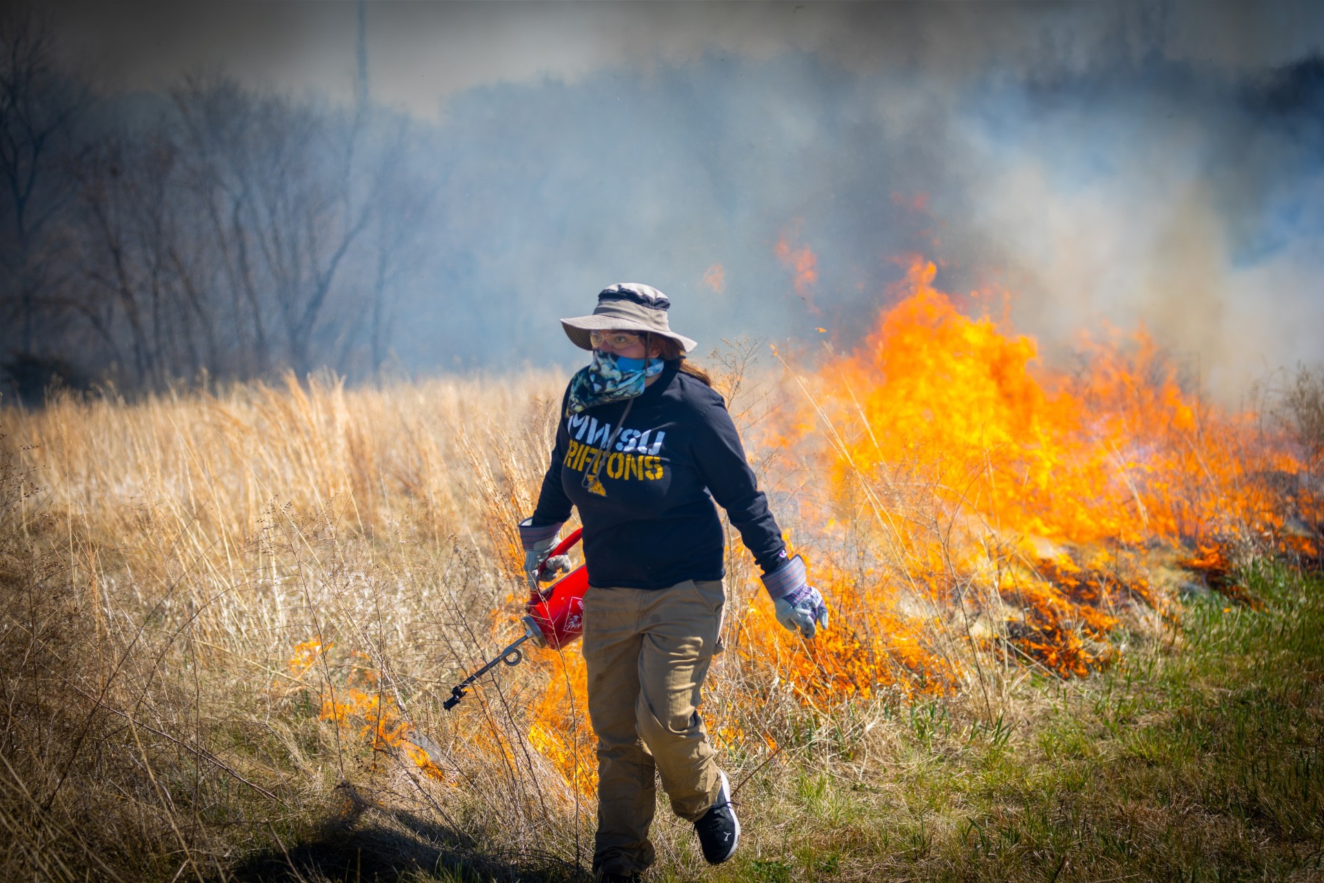 A MoWest student participates in a prescribed burn of the John Rushin Teaching and Research Prairie on April 1, 2023.