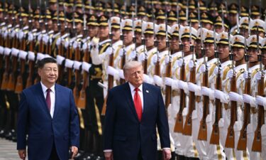 US President Donald Trump and China's leader Xi Jinping inspect a guard of honor during a welcome ceremony at the Great Hall of the People in Beijing on Thursday.