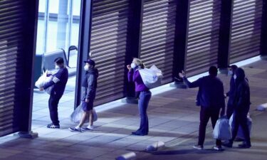 Passengers evacuated from the cruise ship MV Hondius disembark after landing at Eindhoven Air Base in the Netherlands on Tuesday.