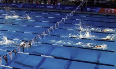 Swimmers compete in the pool during the Pro Swim Series event in Sacramento